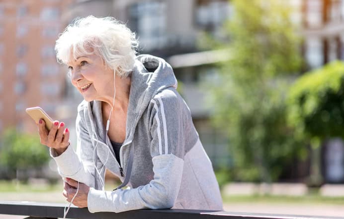 older woman using voice assistance